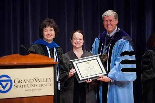 President and Provost pose with honored faculty member